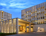 Striking beige stone ensemble of The Lodhi, one of the top New Delhi business hotels in a luxury setting