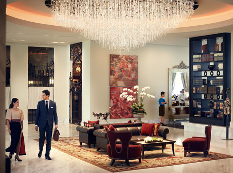 A crystal shower chandelier greets guests at the intimate lobby