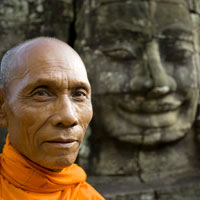 Angkor temple guide, Bayon giant face carving and monk