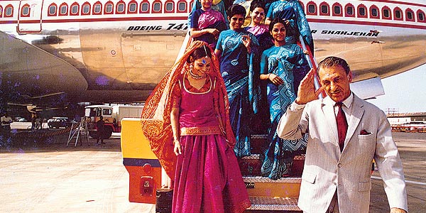 JRD Tata in front of an Air India B747 and saree-clad air hostesses