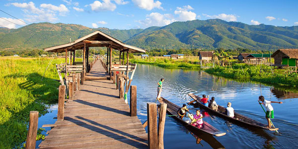 Boats ply on Inle Lake