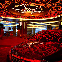New Macau casino hotels review, neon reflections at Studio City