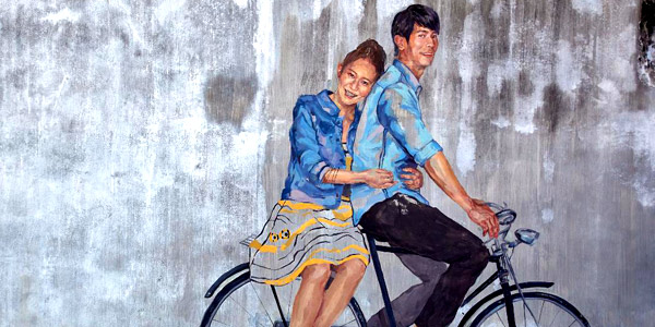 Penang wall art - couple on a bicycle, photo by David Sutton