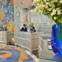 Marble texured lobby at The Reverie Saigon, a top HCMC luxury hotels pick