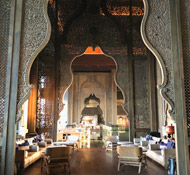 Elaborate wood filigree work adorns the breezy cliff-top lobby