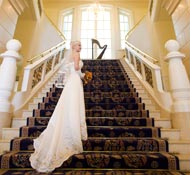 A grand staircase leads up from the lobby