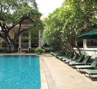 Shaded swimming pools flank the the central courtyard