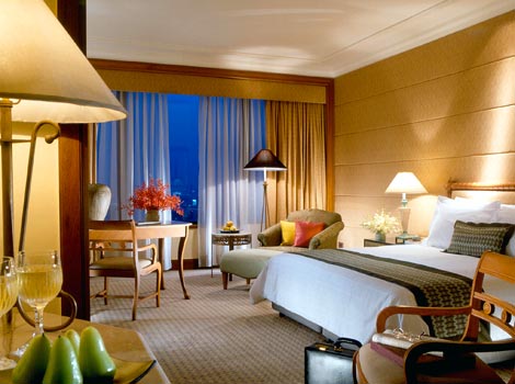 Spacious rooms and suites feature blond-wood and pastel hues