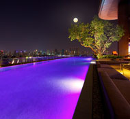 Neon-lit outdoor pool at Sofitel So Bangkok