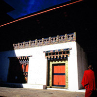 Bhutan travel guide, red-robed monk, photo: Vijay Verghese