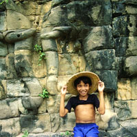 Angkor guide, smiling boy at temple