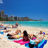 Honolulu fun guide, sun-tanning bodies at Waikiki Beach
