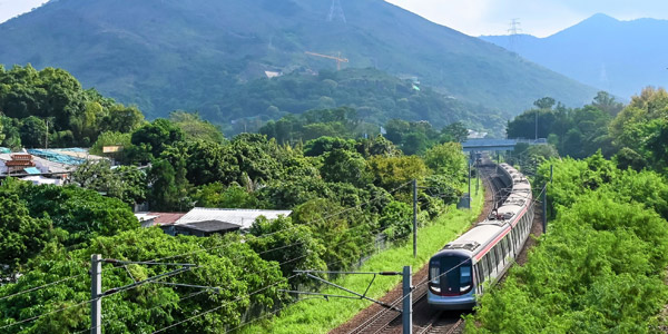 Hong Kong MTR clattering through the green northern countryside