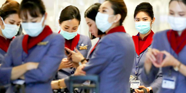 Masks galore but no less focus on cabin crew faces as they wait for their flight