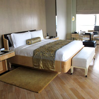 Keraton at the Plaza rooms are spacious, woody and minimalist
