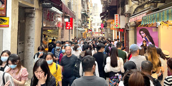 Crowds throng the alleyways leading to St Paul's ruins in Macau