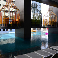 Manila hip hotels, I'M Hotel birdcage loungers at pool
