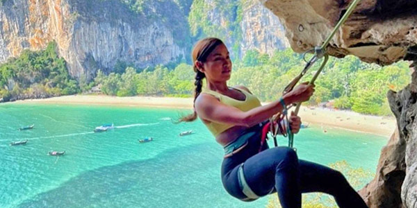 Hotelier Beau Khemwanta Tang tackles a rock face at Railey Beach, Krabi