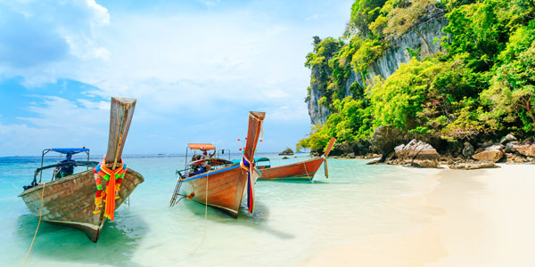 Best travel sites for Asia - Phi Phi beach and longtail boats